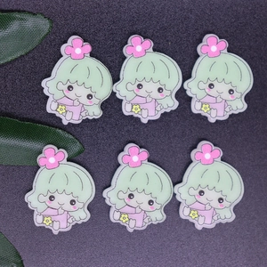 Detailed view of six miniature green-haired cartoon figures for DIY craft accessories