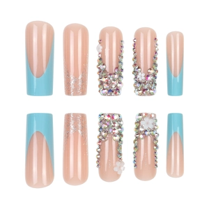 Blue French floral press-on nails with rhinestones in a long coffin shape design