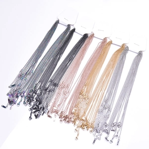 Detail of 2mm ball chain necklaces in multi-color finishes with secure lobster clasps