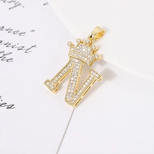 Detailed view of a gold-plated crown letter N pendant with sparkling zircon stones
