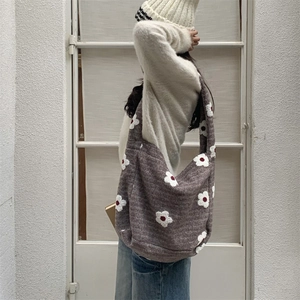 Detail of plush floral tote bag showing high capacity and soft brown fabric texture