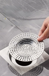 Installation of stainless steel drain filter basket into the floor base for odor prevention