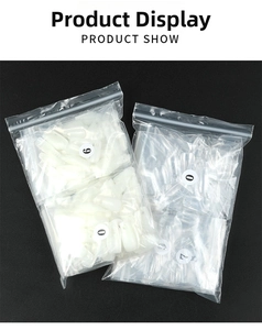 Bulk coffin nail tips set in white and clear colors with numbered size labels