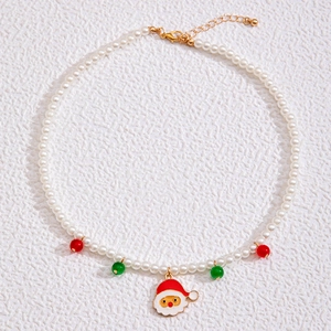 Christmas necklace featuring snowman pendant, imitation pearls, and festive red green beads