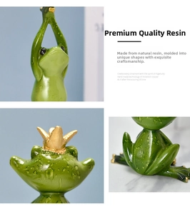 Detail view of resin frog figurine with water drop texture and golden crown