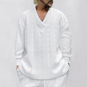 Close-up of men's white V-neck knitted sweater with textured cable knit patterns