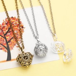 Detailed view of vintage hollow aromatherapy lockets and openable heart pendant necklaces