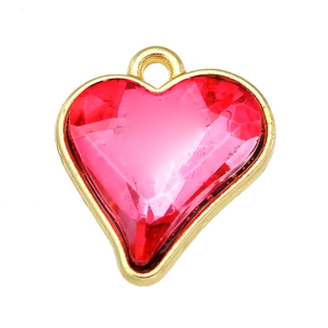 Detailed view of red crystal heart pendant with gold-plated frame and top loop
