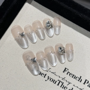 Sparkling cat eye press-on nails with K9 crystals and pearls in long french style