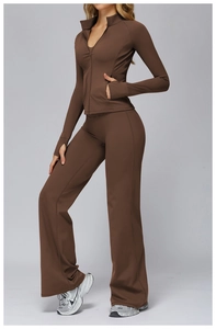 Detail of high-neck jacket with thumbhole cuffs and flared yoga leggings in dark brown
