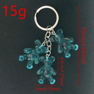 Cute blue jelly gummy bear keychain with size measurements on black background