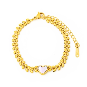 Macro shot of 18K gold plated titanium steel wheat chain with white shell heart pendant