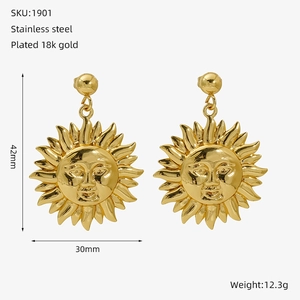 Detailed view of gold sun-shaped earrings in stainless steel with 42x30mm dimensions