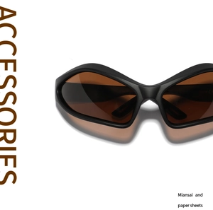 Close-up of matte black Y2K sports sunglasses with brown lenses and sleek cat-eye design