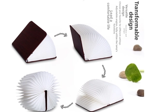 Multiple folding stages of a wooden LED book lamp showing 360-degree rotation angles