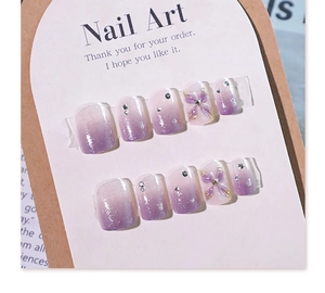 Detail of purple gradient short square press-on nails with 3D flowers and silver glitter