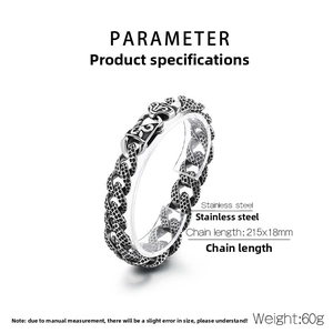 Macro detail of men's stainless steel Cuban bracelet with vintage engraved patterns