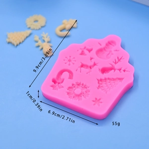 Pink Christmas silicone mold for DIY baking with deer, tree and snowflake shapes