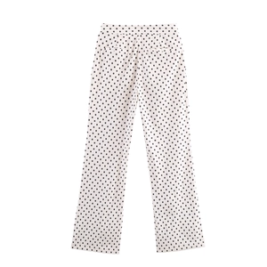 Pantalon blanc décontracté à pois noirs avec coupe large et taille élastique pour femme