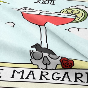 Close-up of heavy twill fabric showing detailed tarot cocktail and skull printing