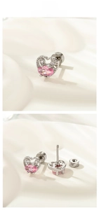 Detail of pink heart-shaped stud earrings with zircons and screw-back screw thread