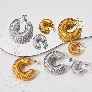 Twisted C-shaped stainless steel hoop earrings in gold and silver color, multiple sizes