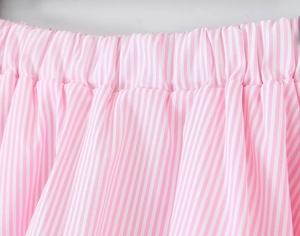 Detail of pink and white vertical striped elastic waistband with soft pleat fabric