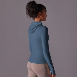 Detail view of hooded sports jacket back profile in greyish blue moisture-wicking fabric