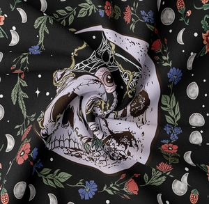 Detailed fabric texture of a black skull and moon phase floral gothic tapestry fabric