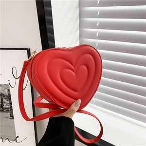 Elegant heart-shaped red crossbody bag with quilted PU leather and gold hardware