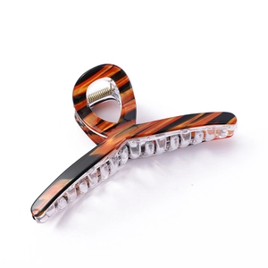 Tortoiseshell patterned hair claw clip with candy color stripes and transparent teeth