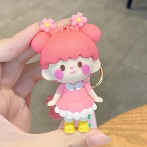 Cute pink cherry blossom girl keychain in soft silicone with golden metal ring charm