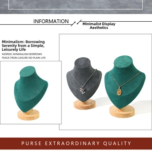 Detail of dark green and grey velvet necklace display stands with solid wood bases