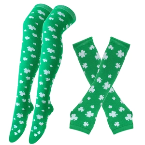 Detail of green knitted over-the-knee socks and arm sleeves with white shamrock pattern