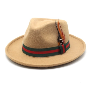 Vintage wool felt fedora hat in camel with striped ribbon and decorative feather detail