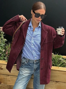 Street style view of oversize burgundy suede jacket with classic lapel and side pockets