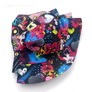 Reversible graffiti bucket hat in black with vibrant street art patterns and colorful prints