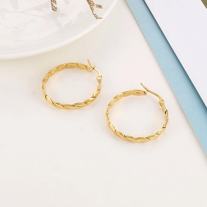Macro shot of 4mm gold-plated stainless steel hoop earrings with elegant twisted design