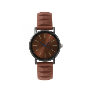 Minimalist quartz watch with brown sunray dial and textured silicone strap in brown color