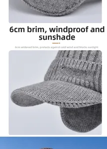 Close-up of a 6cm brim on a dark grey knitted visor hat with Sport embroidery detail