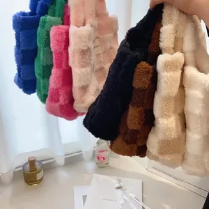 Row of plush waffle texture bucket bags in various colors for autumn and winter collection
