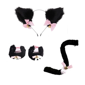 Detail of black faux fur cat ear headband, fluffy tail and cuffs with pink bow and gold bell