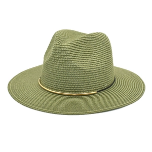 Detail of olive green straw fedora hat featuring a woven texture and gold metal buckle
