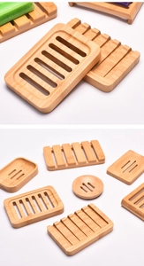 Detailed view of bamboo soap dishes showing various natural wood shapes and drainage slots