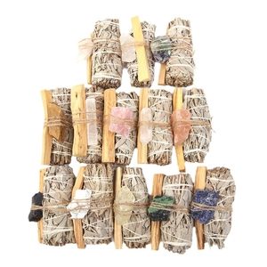 White sage smudge sticks with palo santo and raw crystals for yoga meditation