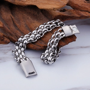 Detail of silver stainless steel woven chain bracelet with magnetic clasp for men