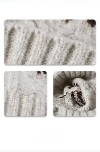 Close-up of thick ribbed knit texture and brown jacquard pattern on a warm winter beanie