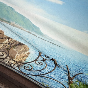 Close-up of Mediterranean seascape tapestry fabric showing detailed texture and printing