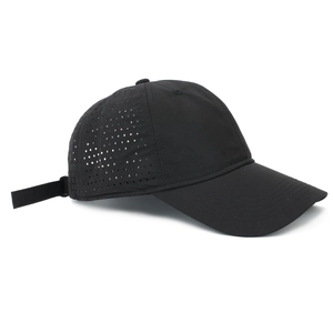 Detail of laser-cut perforations and adjustable strap on a black quick-dry baseball cap