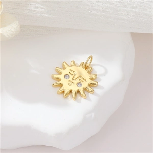Macro detail of gold sun face pendant with micro-inlaid zircon eyes and polished finish